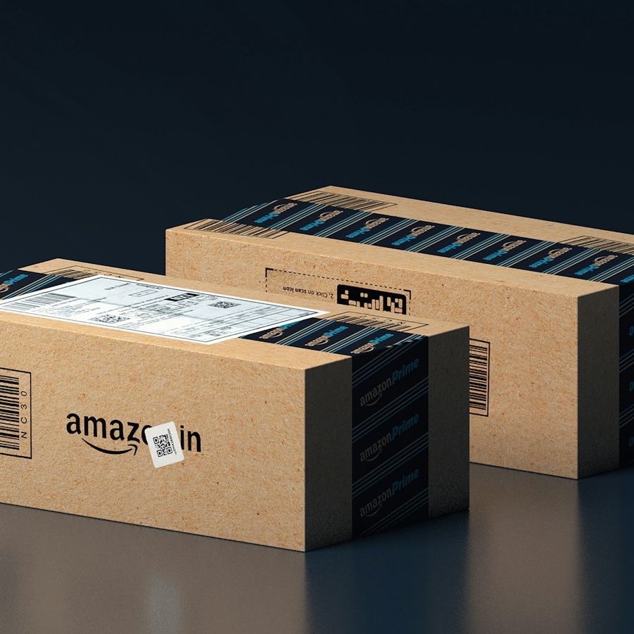 two boxes of amazon are stacked on top of each other
